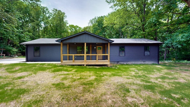 2038 Ogburn Chapel Rd, Clarksville, TN 37042 - back of property featuring covered porch, a lawn, crawl space, and view of scattered trees