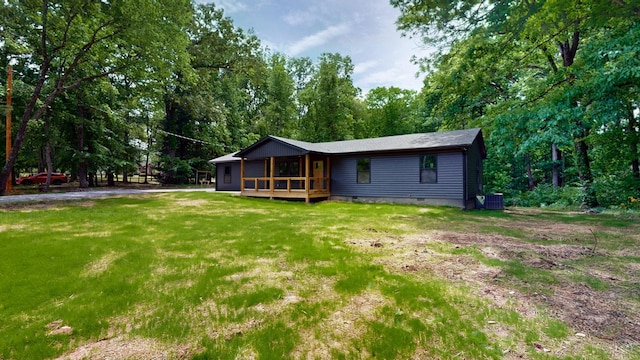2038 Ogburn Chapel Rd, Clarksville, TN 37042 - back of property featuring crawl space, a deck, a lawn, and central AC