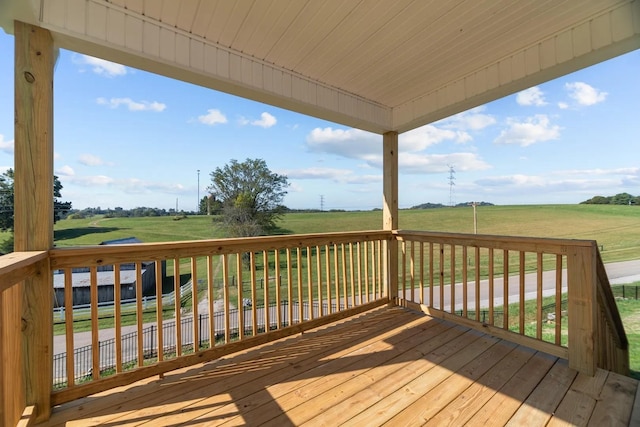 wooden deck featuring a view of rural / pastoral area