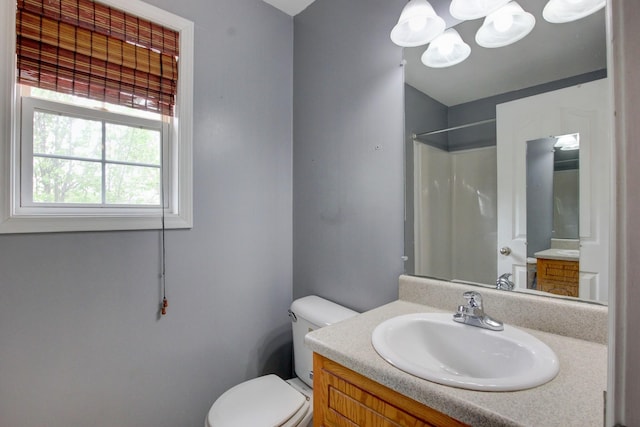 full bath with a shower, toilet, and vanity