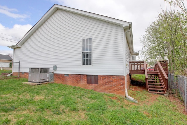 rear view of house featuring central AC unit, stairs, a deck, and crawl space