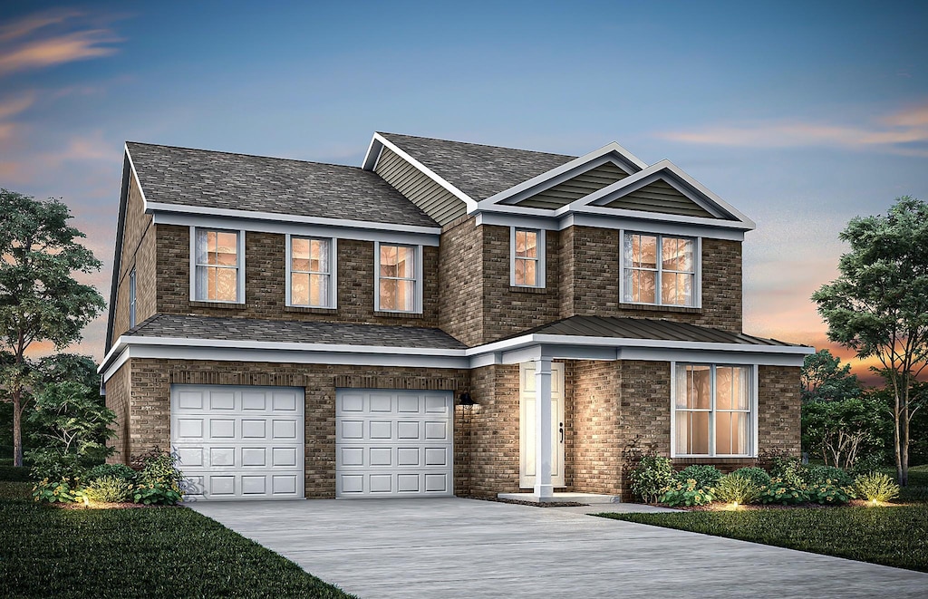 view of front of home featuring concrete driveway, an attached garage, a standing seam roof, and brick siding