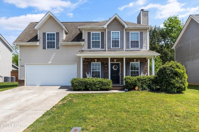 516 Trainmaster Dr, Maryville, TN 37804 - view of front of home featuring concrete driveway, a front yard, brick siding, central AC unit, and a chimney