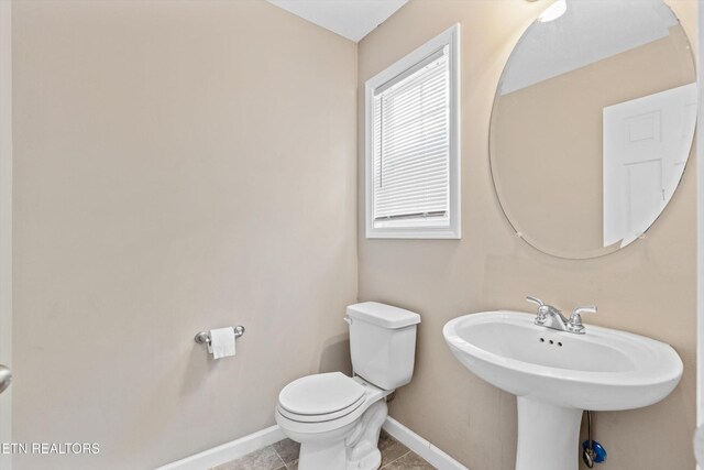 516 Trainmaster Dr, Maryville, TN 37804 - half bathroom featuring baseboards, toilet, and tile patterned floors