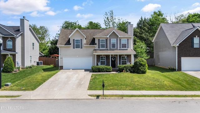 516 Trainmaster Dr, Maryville, TN 37804 - traditional-style house with driveway, central air condition unit, a garage, a porch, and a chimney