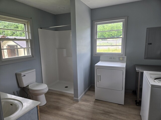 307 E Commerce St, Waverly, TN 37185 - bathroom with washer / dryer, electric panel, vanity, and wood finished floors