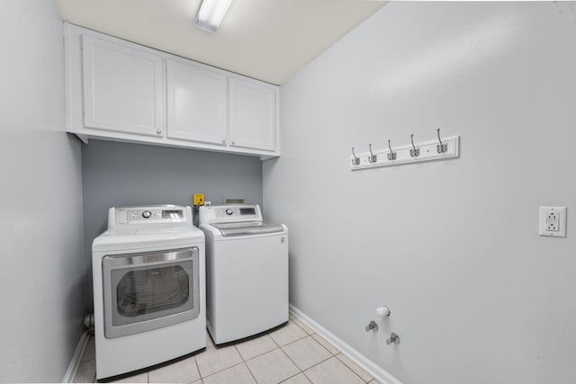 3630 W Trimble Rd, Milton, TN 37118 - clothes washing area featuring cabinet space, washer and dryer, baseboards, and light tile patterned flooring
