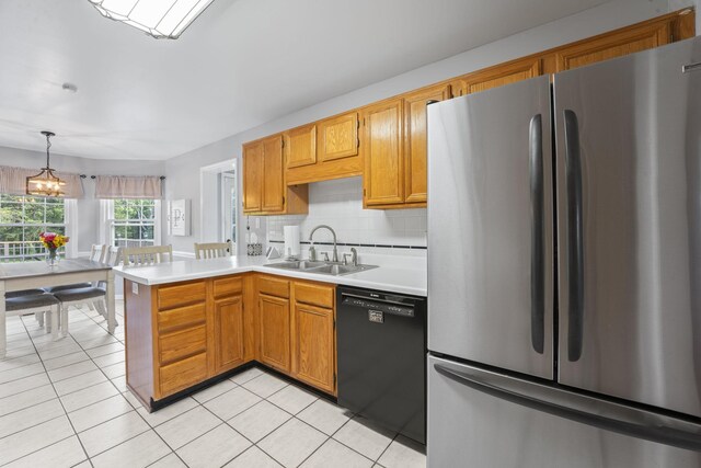3630 W Trimble Rd, Milton, TN 37118 - kitchen with freestanding refrigerator, dishwasher, a sink, light countertops, and a chandelier