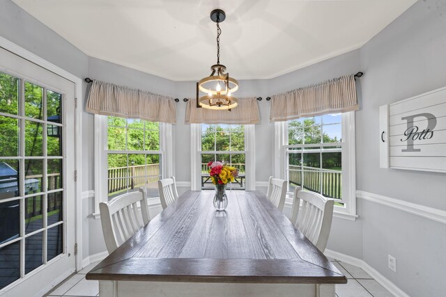3630 W Trimble Rd, Milton, TN 37118 - dining area featuring light tile patterned flooring, a chandelier, and baseboards
