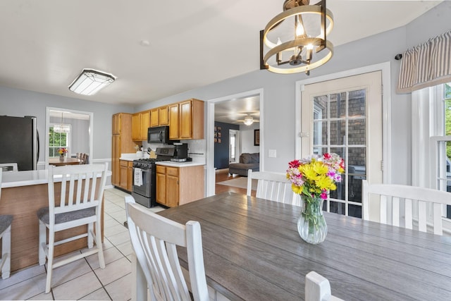 3630 W Trimble Rd, Milton, TN 37118 - dining area with a chandelier, light tile patterned floors, and healthy amount of natural light