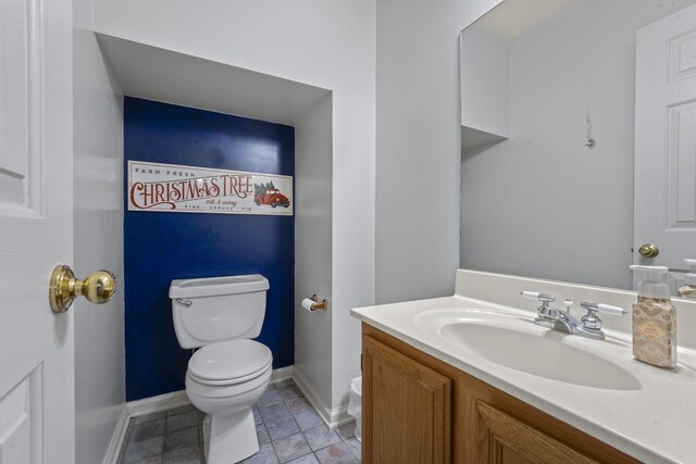 3630 W Trimble Rd, Milton, TN 37118 - bathroom with toilet, vanity, baseboards, and tile patterned flooring