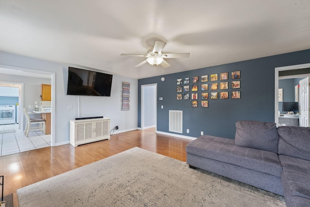 3630 W Trimble Rd, Milton, TN 37118 - living room with a ceiling fan, wood finished floors, and baseboards