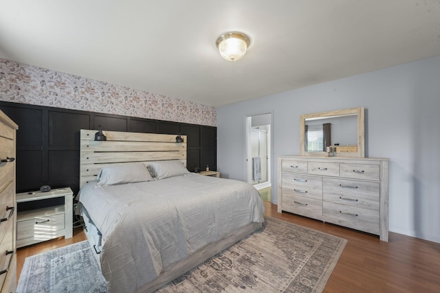 3630 W Trimble Rd, Milton, TN 37118 - bedroom with wood finished floors, wallpapered walls, and ensuite bath