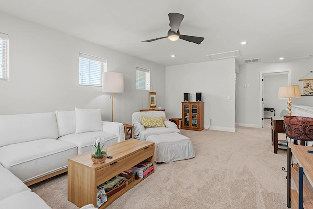 living area featuring recessed lighting, ceiling fan, light carpet, and baseboards