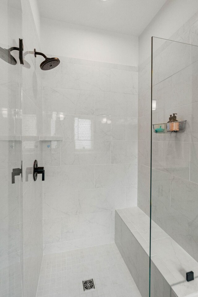 full bath featuring tiled shower