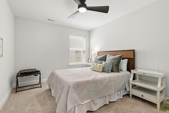 carpeted bedroom with baseboards and ceiling fan