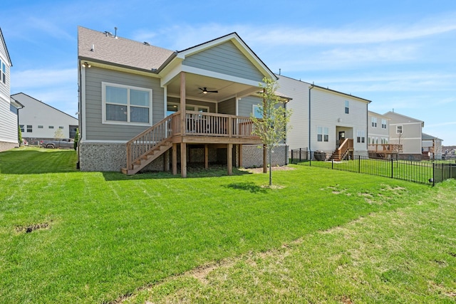 rear view of house with stairs, ceiling fan, and roof with shingles