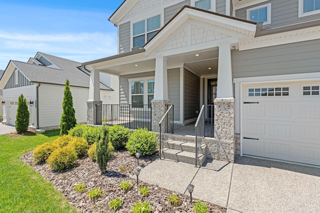 view of front of house with covered porch, a garage, and driveway