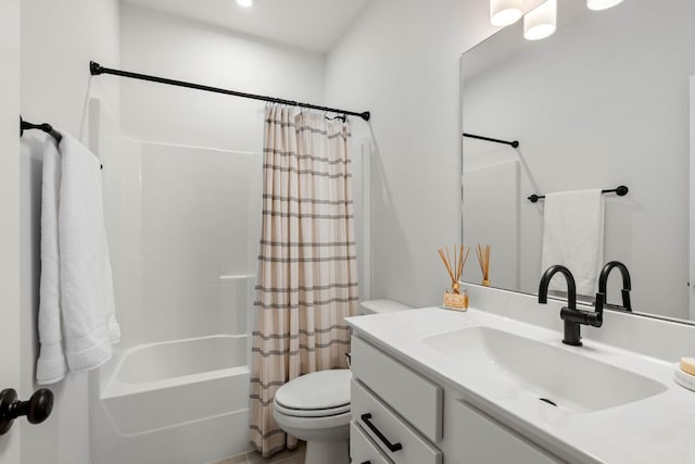 full bath with toilet, shower / tub combo, and vanity