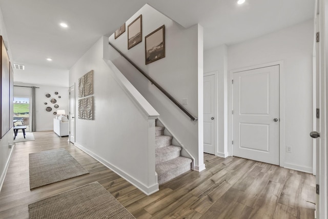 2562 Beverly Gail Rd, Pleasant View, TN 37146 - hall featuring wood finished floors, stairway, and recessed lighting