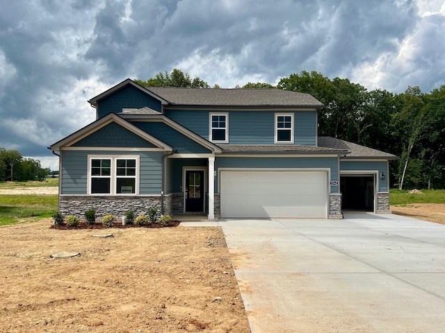 2562 Beverly Gail Rd, Pleasant View, TN 37146 - craftsman-style home with stone siding, concrete driveway, and a garage