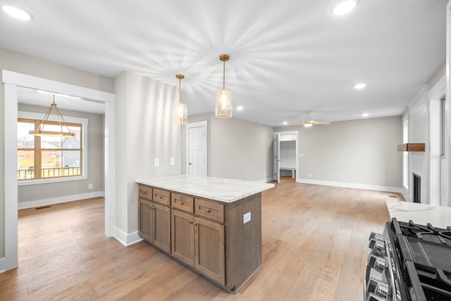 1912 Flats Rd, Cunningham, TN 37052 - kitchen featuring recessed lighting, brown cabinetry, baseboards, light wood-style floors, and open floor plan