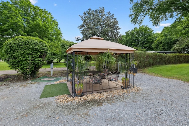 view of home's community with a gazebo and a lawn