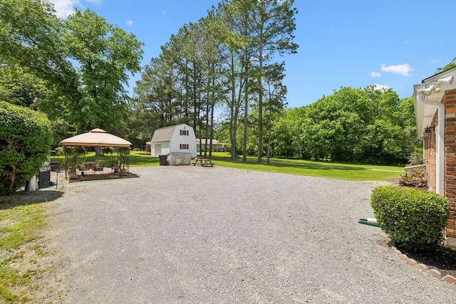 view of community with a gazebo and a lawn