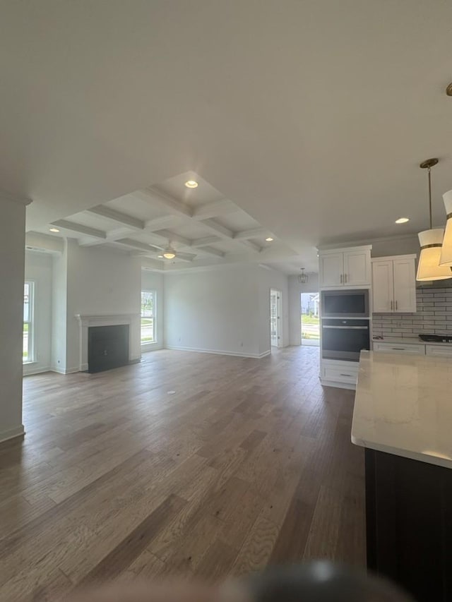 6709 Major Hutchings Dr, Hermitage, TN 37076 - unfurnished living room featuring a ceiling fan, wood finished floors, beam ceiling, recessed lighting, and coffered ceiling