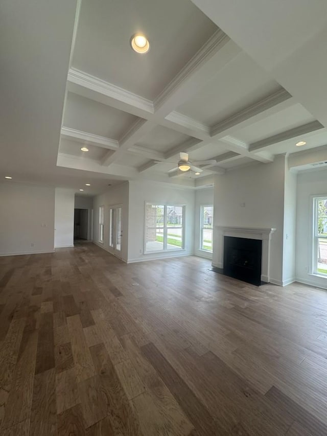 6709 Major Hutchings Dr, Hermitage, TN 37076 - unfurnished living room featuring coffered ceiling, beam ceiling, wood finished floors, a fireplace with flush hearth, and a ceiling fan