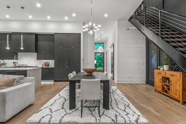 4303A Utah Ave, Nashville, TN 37209 - dining space featuring recessed lighting, light wood-style flooring, a chandelier, and baseboards