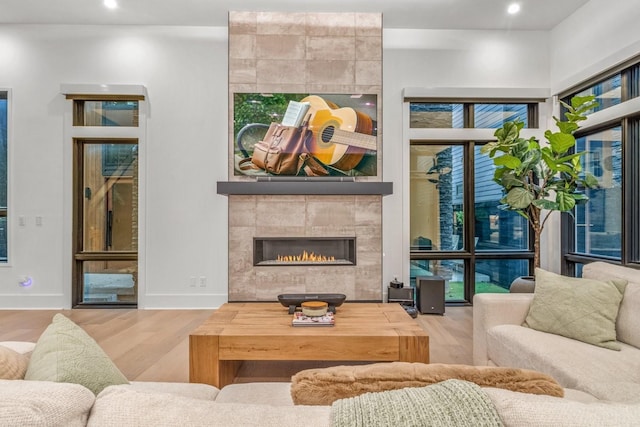 4303A Utah Ave, Nashville, TN 37209 - living room featuring a tile fireplace, wood finished floors, recessed lighting, and baseboards