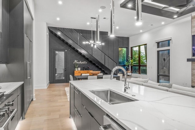 4303A Utah Ave, Nashville, TN 37209 - kitchen with a sink, open floor plan, modern cabinets, light wood-type flooring, and gray cabinetry
