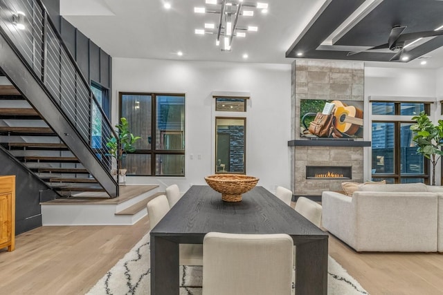 4303A Utah Ave, Nashville, TN 37209 - dining space with a tiled fireplace, stairway, light wood-type flooring, a ceiling fan, and recessed lighting