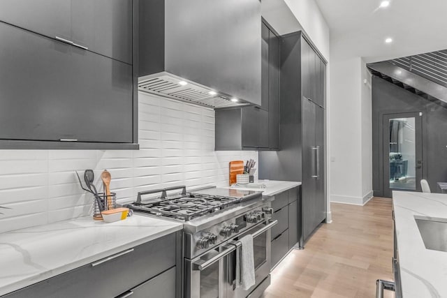 4303A Utah Ave, Nashville, TN 37209 - kitchen featuring range with two ovens, modern cabinets, recessed lighting, decorative backsplash, and light wood finished floors