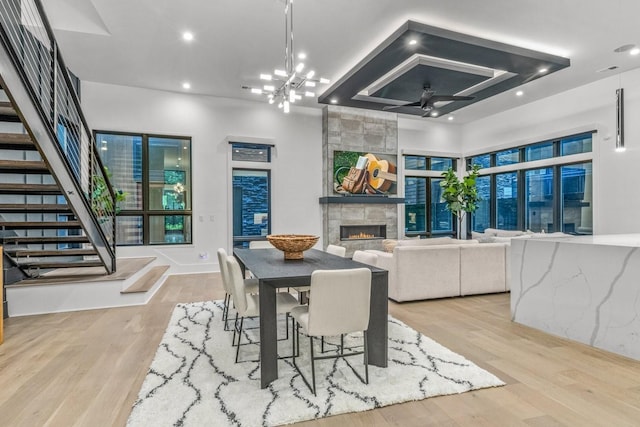 4303A Utah Ave, Nashville, TN 37209 - dining space featuring ceiling fan, a tile fireplace, wood finished floors, stairway, and recessed lighting