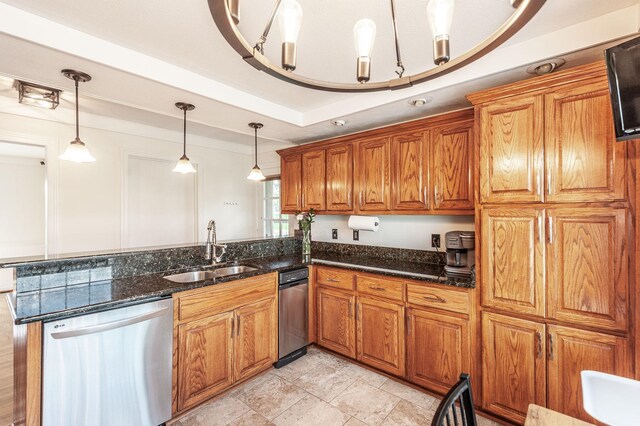 kitchen featuring stainless steel dishwasher, a sink, brown cabinetry, and a peninsula