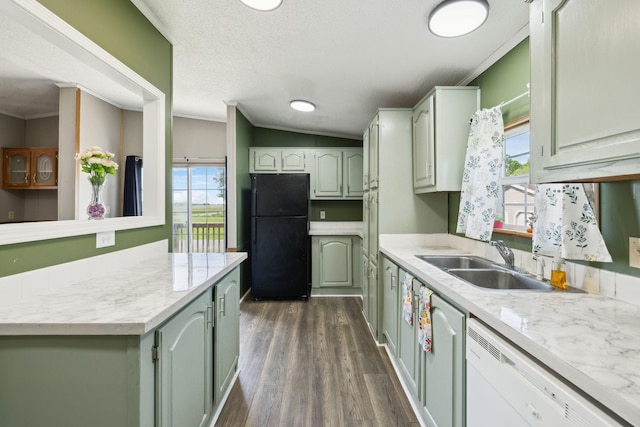 kitchen featuring freestanding refrigerator, dishwasher, a sink, dark wood-style floors, and ornamental molding