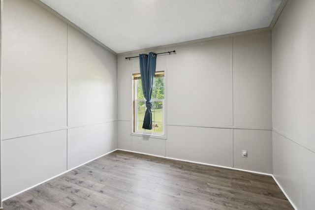 unfurnished room featuring wood finished floors