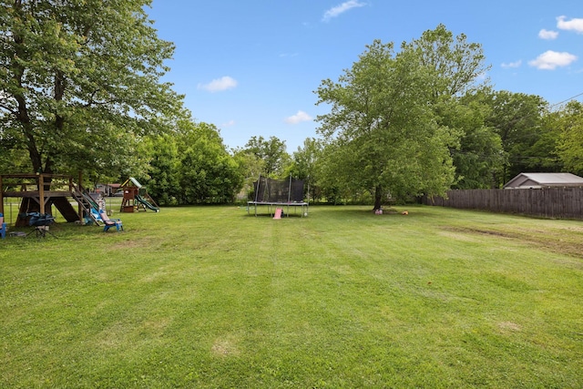 221 N Ewing St, Guthrie, KY 42234 - view of yard with a trampoline and a playground