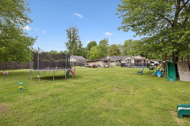 221 N Ewing St, Guthrie, KY 42234 - view of yard with a trampoline and a playground
