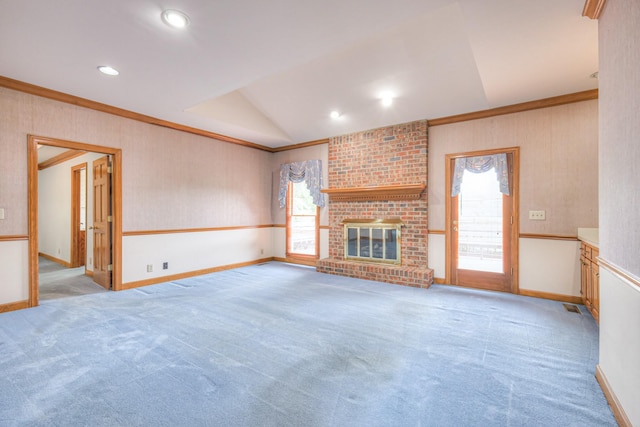 145 Dekewood Dr, Old Hickory, TN 37138 - unfurnished living room featuring crown molding, vaulted ceiling, carpet flooring, a fireplace, and baseboards