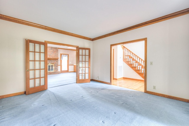 145 Dekewood Dr, Old Hickory, TN 37138 - spare room featuring french doors, carpet, ornamental molding, baseboards, and stairs