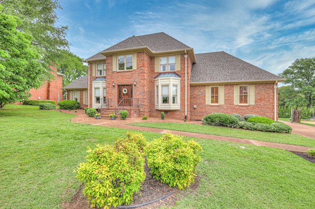 145 Dekewood Dr, Old Hickory, TN 37138 - view of front facade with a front lawn, brick siding, and a shingled roof