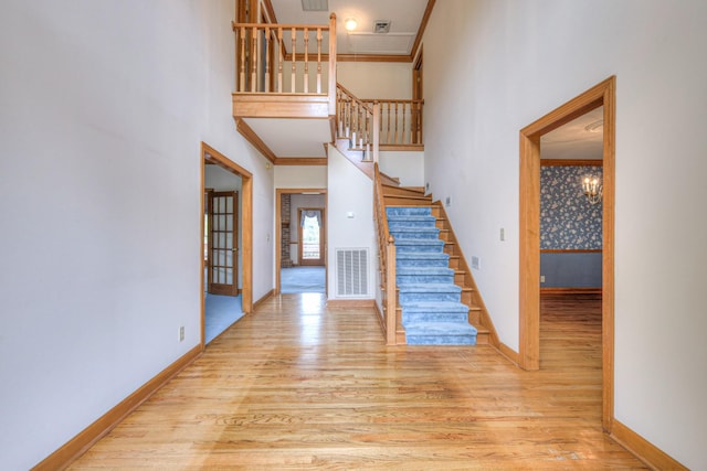 145 Dekewood Dr, Old Hickory, TN 37138 - stairs featuring wood finished floors, a towering ceiling, baseboards, and ornamental molding