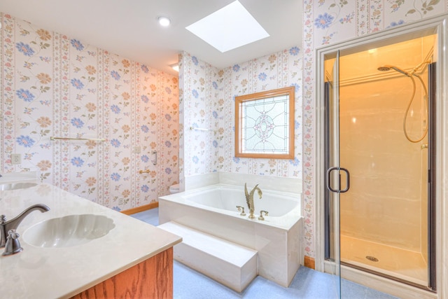 145 Dekewood Dr, Old Hickory, TN 37138 - full bathroom with a skylight, wallpapered walls, a stall shower, a bath, and baseboards