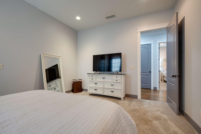 carpeted bedroom with baseboards and recessed lighting