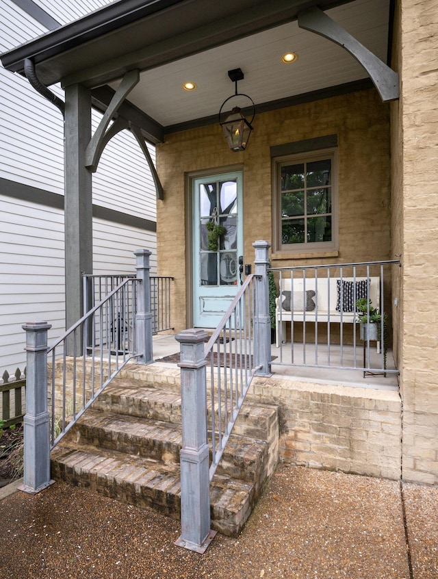 view of exterior entry featuring a porch