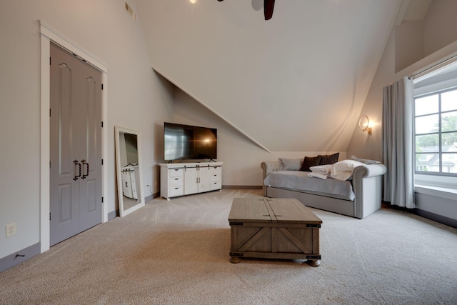 living room with carpet floors, a ceiling fan, high vaulted ceiling, and baseboards