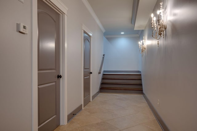 hallway with crown molding, stairs, a chandelier, baseboards, and recessed lighting